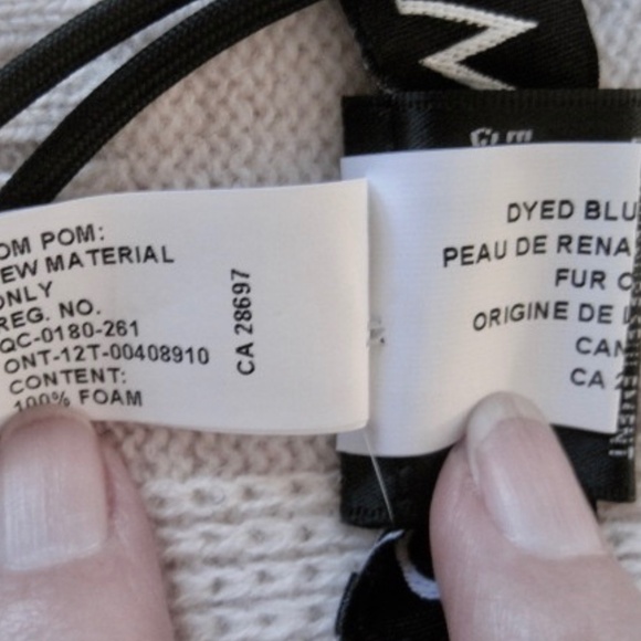 Michie's Criss Cross Scarf With Fur Pom Poms - Picture 8 of 9